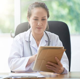 Female Doctor With Digital Tablet